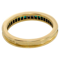 Emerald and diamond band in 18 carat gold