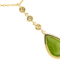 Peridot and diamond pendant in 18 carat gold