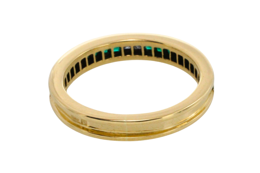 Emerald and diamond band in 18 carat gold