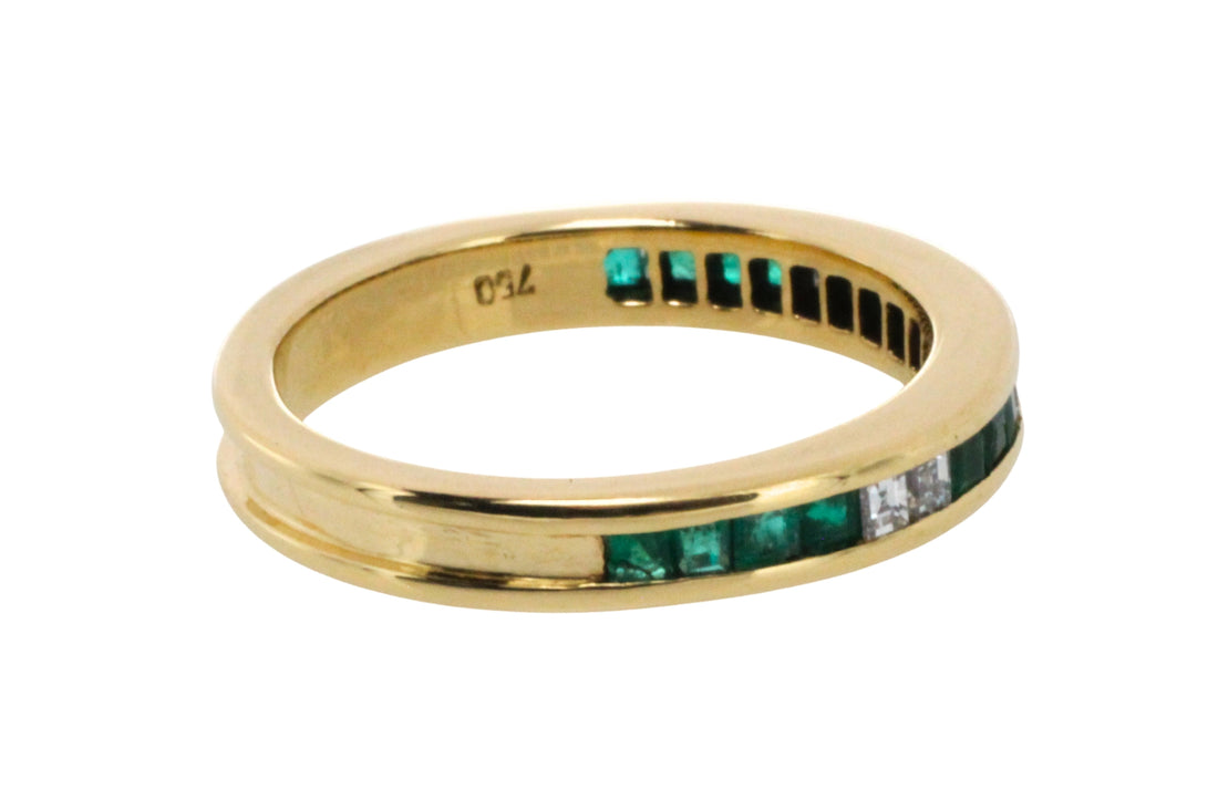 Emerald and diamond band in 18 carat gold