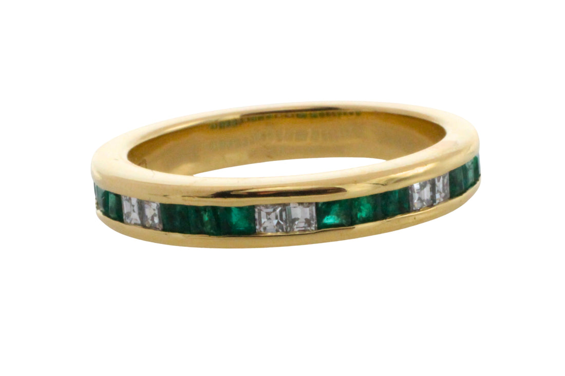 Emerald and diamond band in 18 carat gold