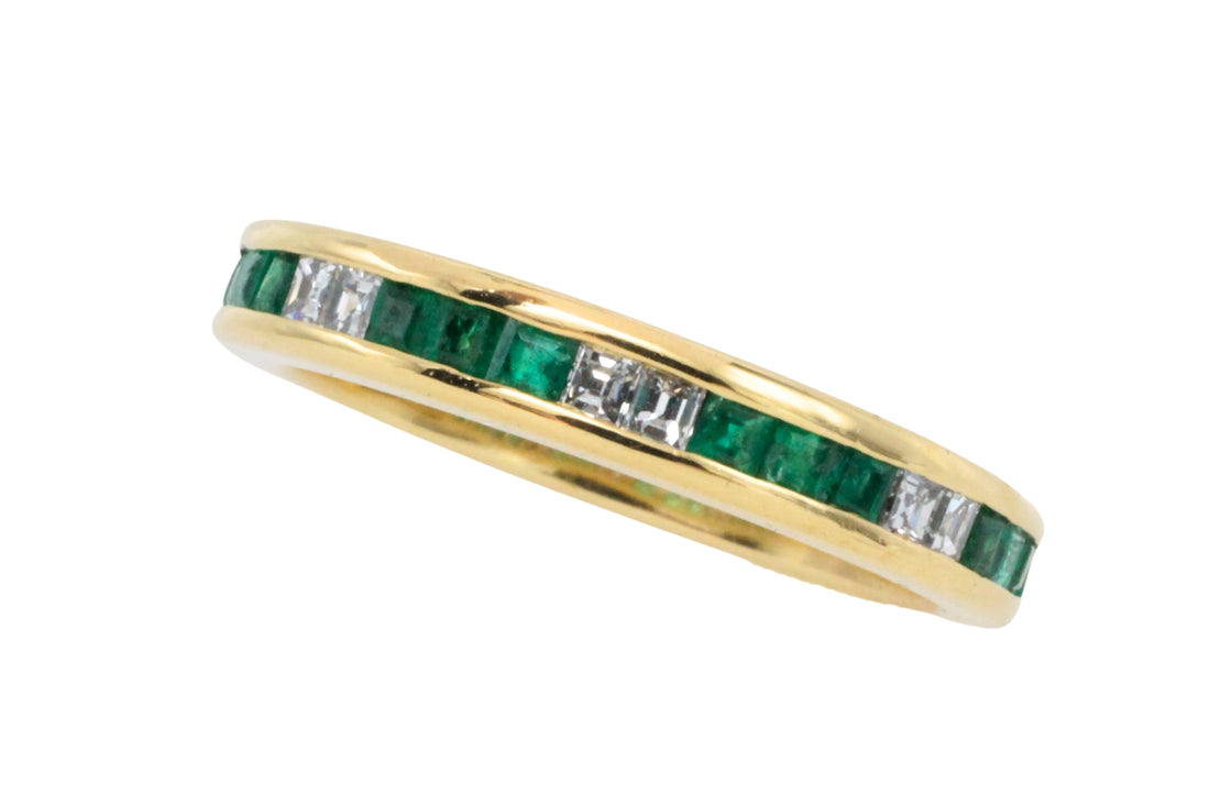 Emerald and diamond band in 18 carat gold