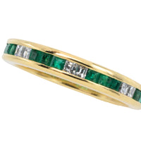 Emerald and diamond band in 18 carat gold