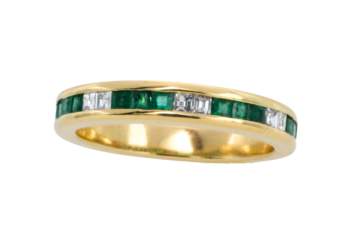 Emerald and diamond band in 18 carat gold
