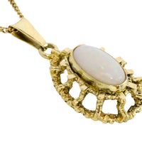 Cabochon opal pendant in 14 carat gold