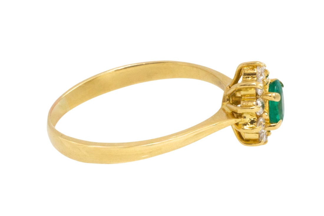 Emerald and diamond cluster ring in 18 carat gold