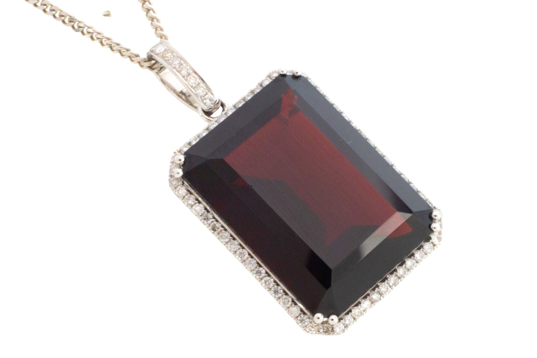 Garnet and diamond pendant in white gold