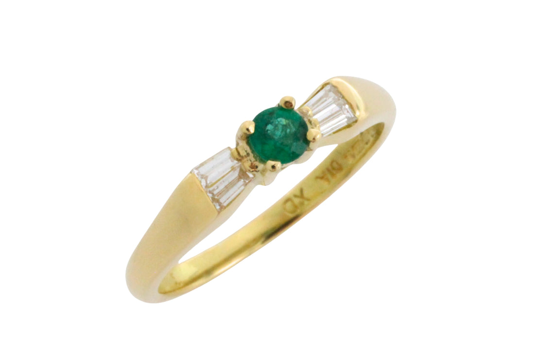 Emerald and baguette diamond ring in 18 carat gold