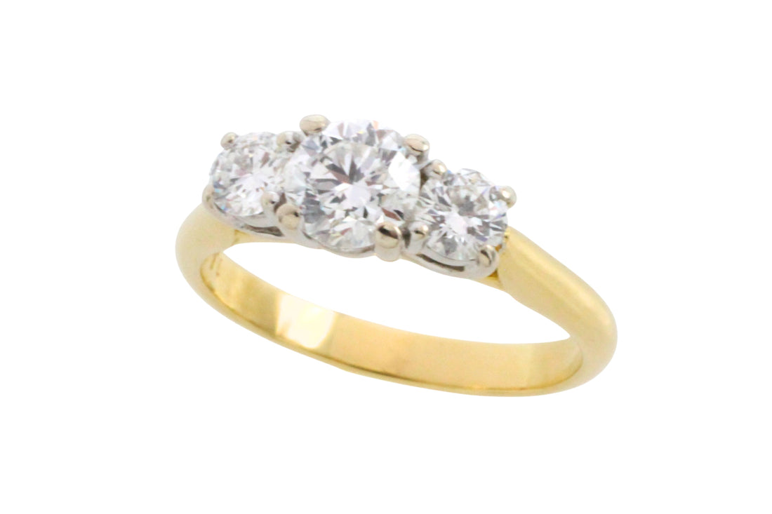 Three stone brilliant cut diamond ring