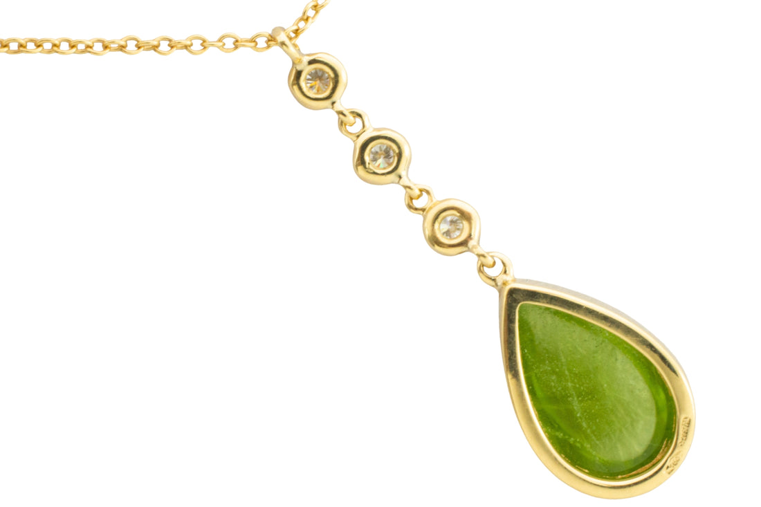 Peridot and diamond pendant in 18 carat gold