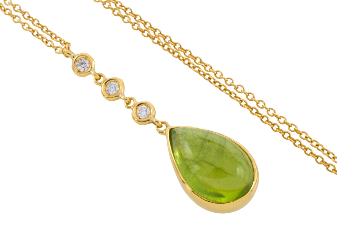 Peridot and diamond pendant in 18 carat gold