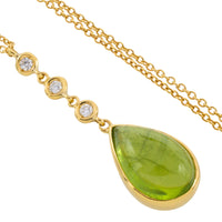 Peridot and diamond pendant in 18 carat gold
