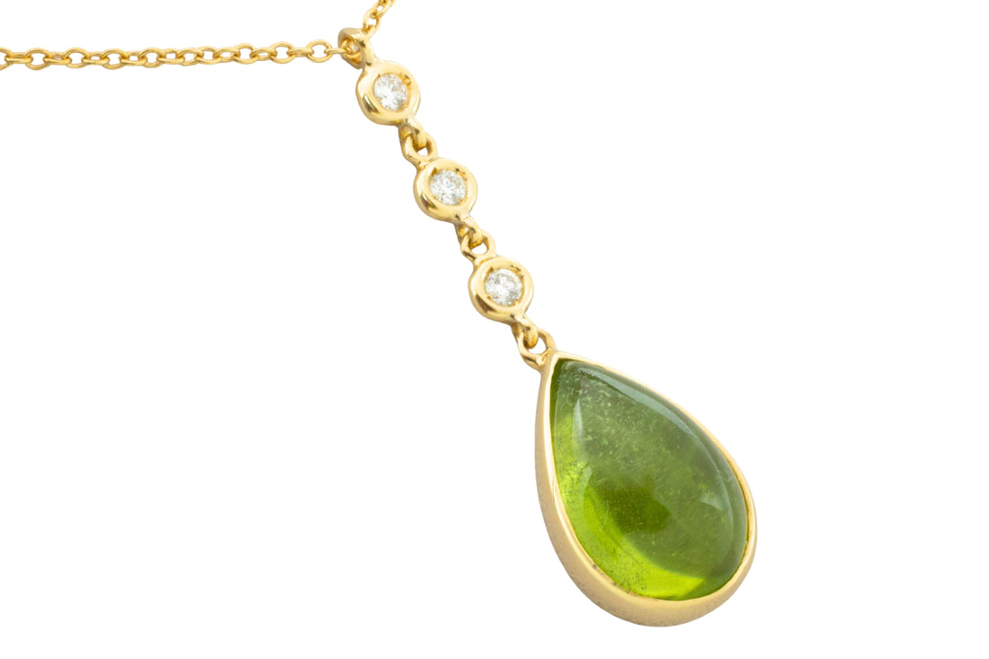 Peridot and diamond pendant in 18 carat gold