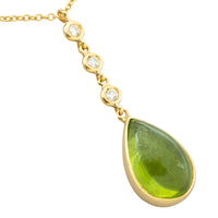 Peridot and diamond pendant in 18 carat gold