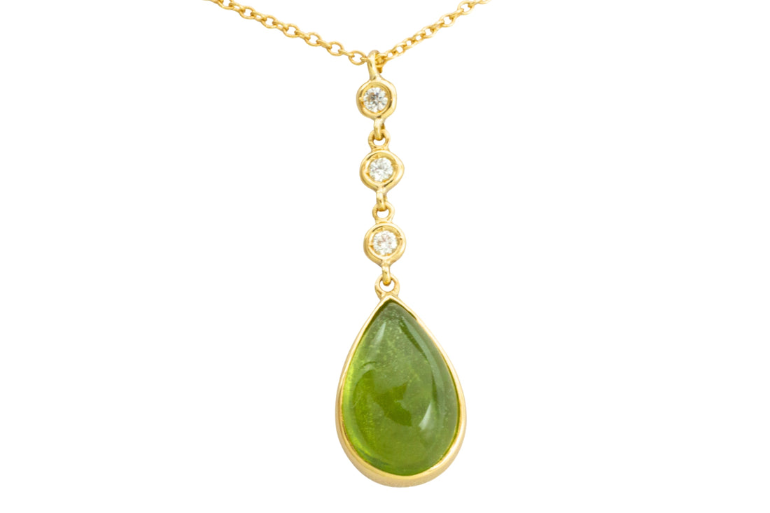 Peridot and diamond pendant in 18 carat gold