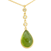 Peridot and diamond pendant in 18 carat gold