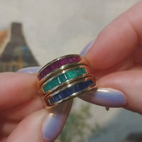 18 carat gold triple band with sapphire, emerald and ruby