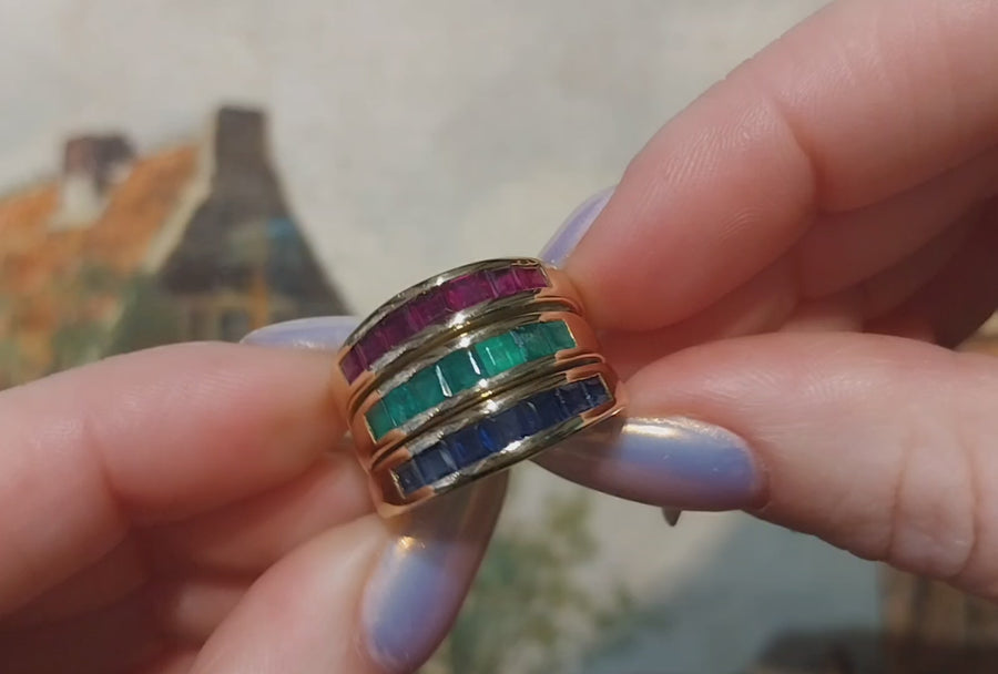 18 carat gold triple band with sapphire, emerald and ruby