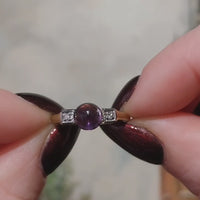 Cabochon amethyst ring with diamonds