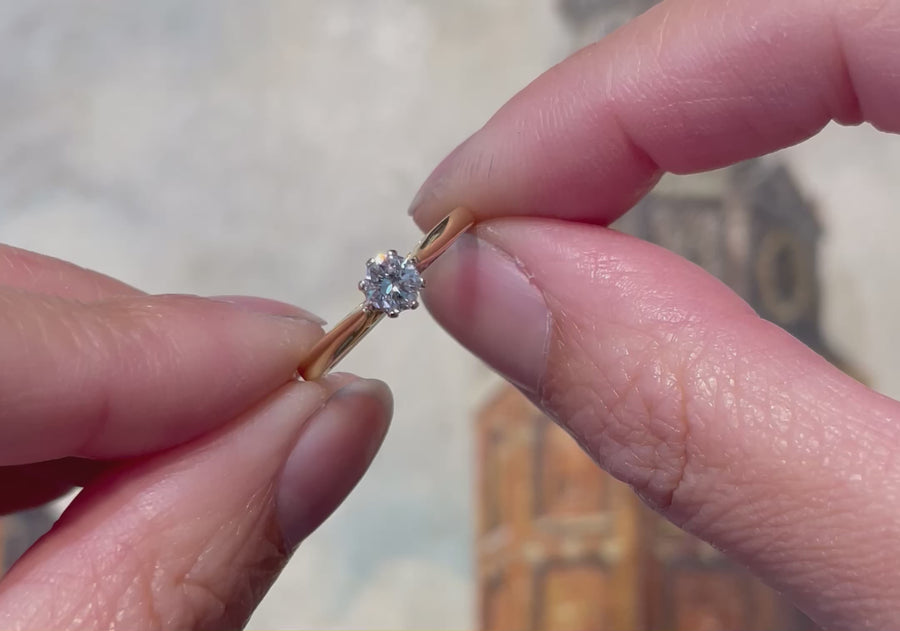 Diamond solitaire ring in yellow and white gold