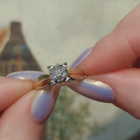 14 carat gold solitaire style ring with diamonds