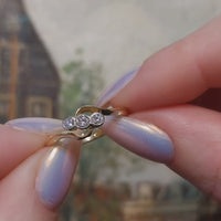 Vintage 18 carat gold swirl ring with diamonds