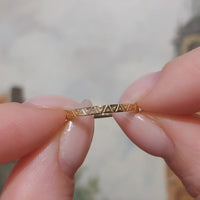 18 carat gold band with motif