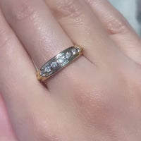 18 carat gold band with brilliant cut diamonds