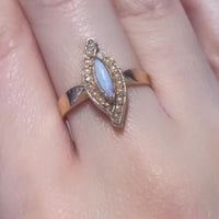 Marquise opal and seed pearl ring in 14 carat gold