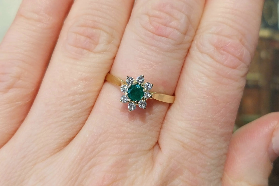 Emerald and diamond cluster ring
