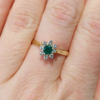 Emerald and diamond cluster ring